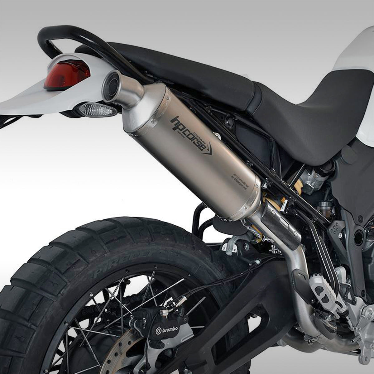 HP CORSE exhaust for the Ducati Desert X. This is the SP-1 high mount slip-on option. Hand made in Italy using Titanium for light weight, durability and great looks. 