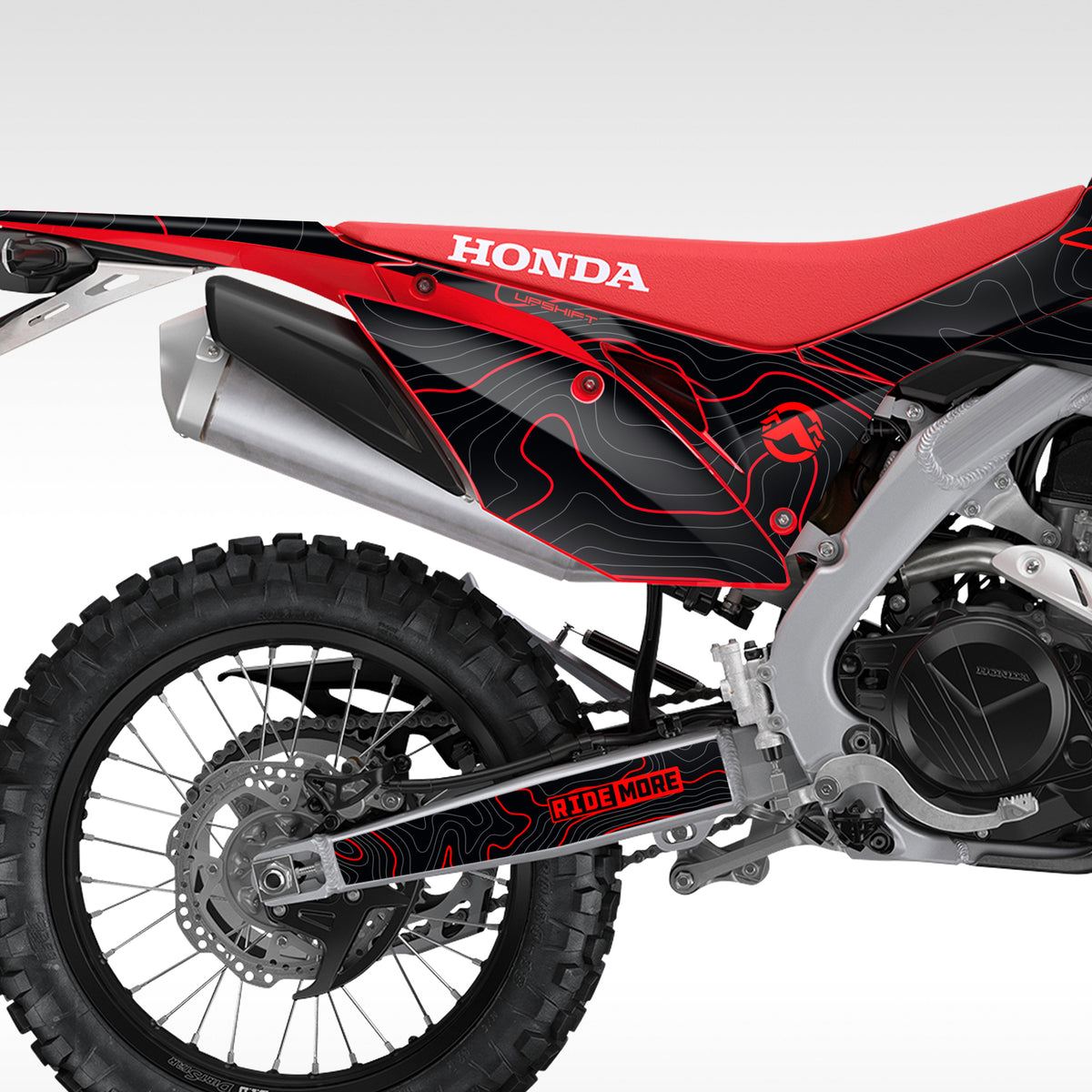 Rear half of a Honda CRF450L / CRF450RL with the Black Red TOPO graphics kit installed.